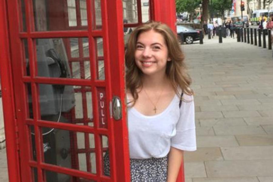  Molly Cochran in Europe, coming out of an English phonebooth.